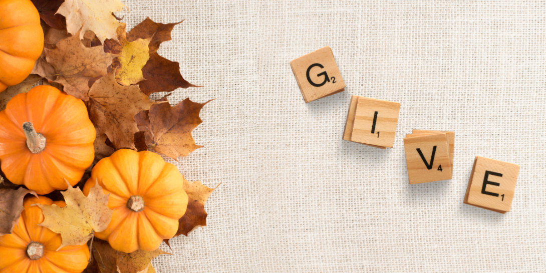 decorative image of pumpkins, leaves, and tiles reading "Give"